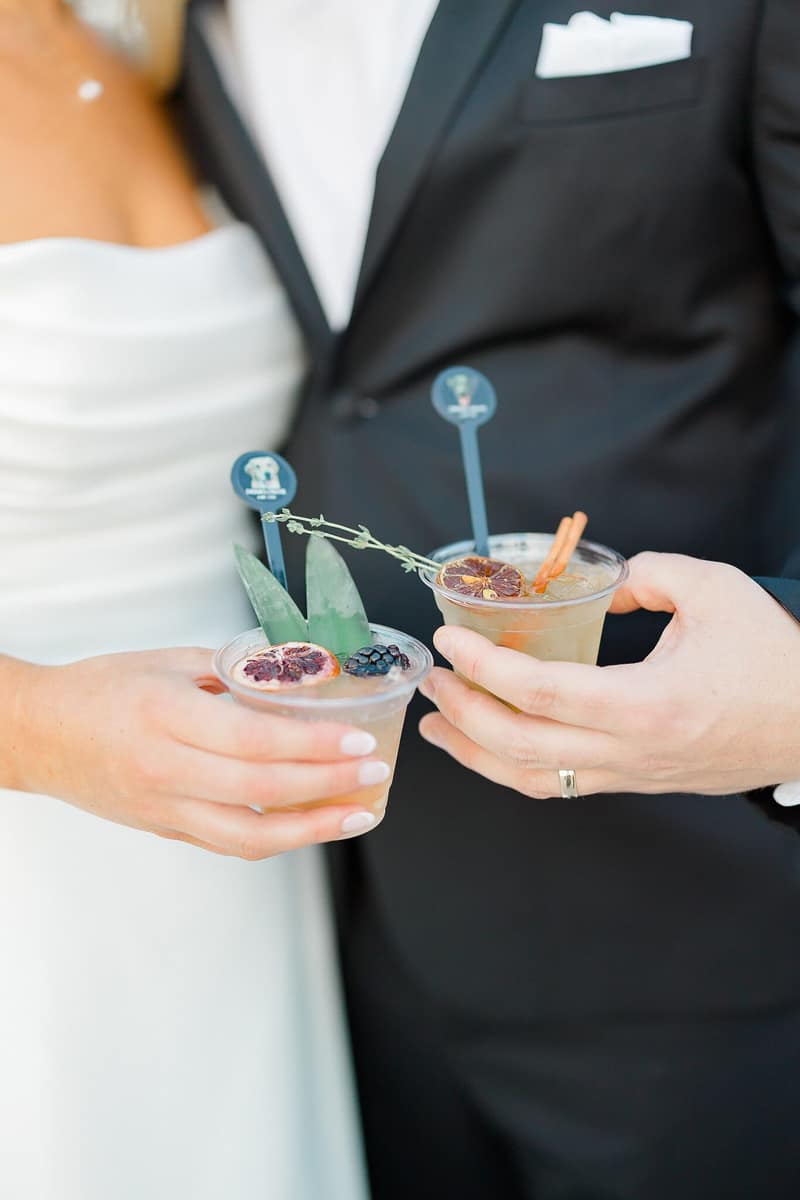 Bride and groom holding their two signature wedding cocktails