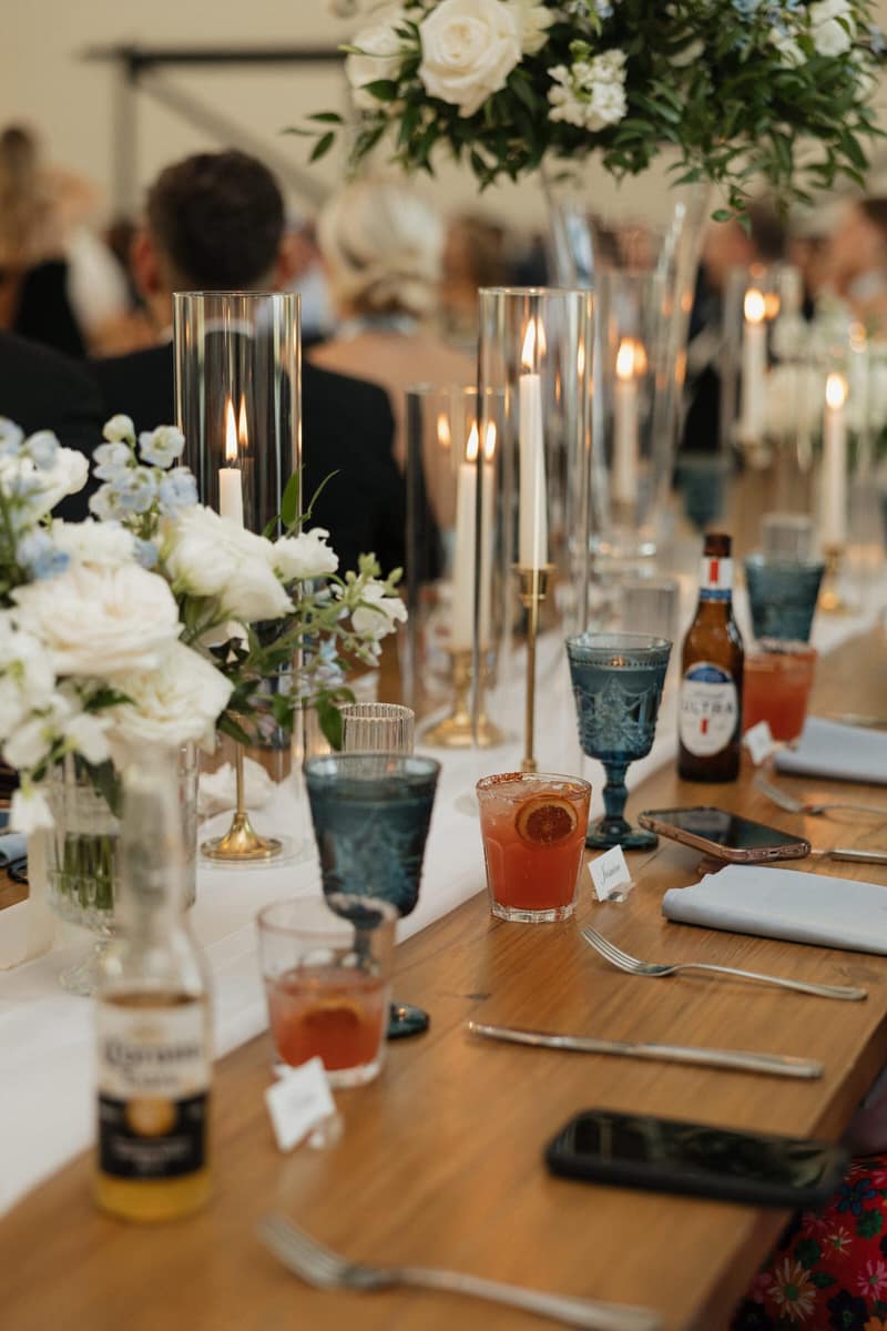 Dallas wedding reception table set with blue goblets and signature cocktails